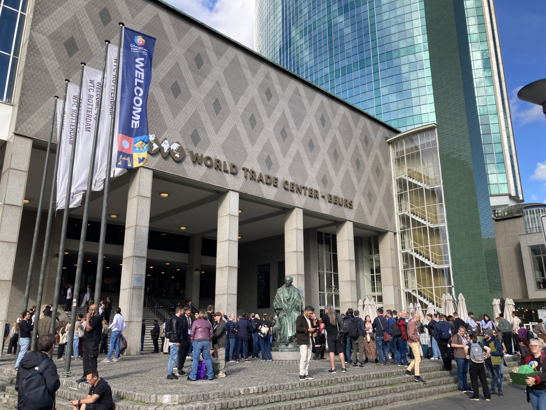 Conference venue with flags on the left, one of them DrupalCon